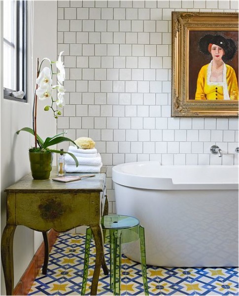 Image of a bathroom with painting and colorful tiles